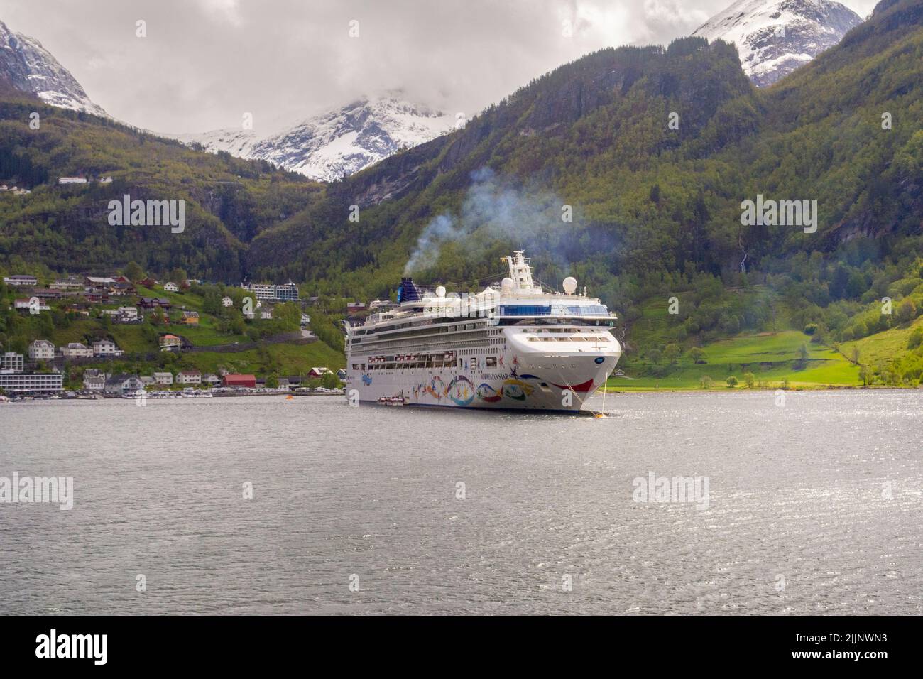 Geiranger, Norway, May 2015: Norwegian Star Cruise Ship moored in a fjord near Flam Stock Photo