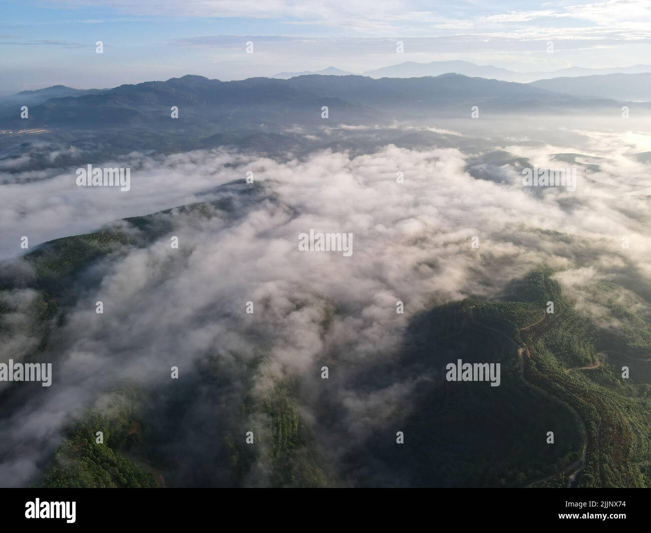 An aerial view of mountain landscape on a foggy day in the countryside ...