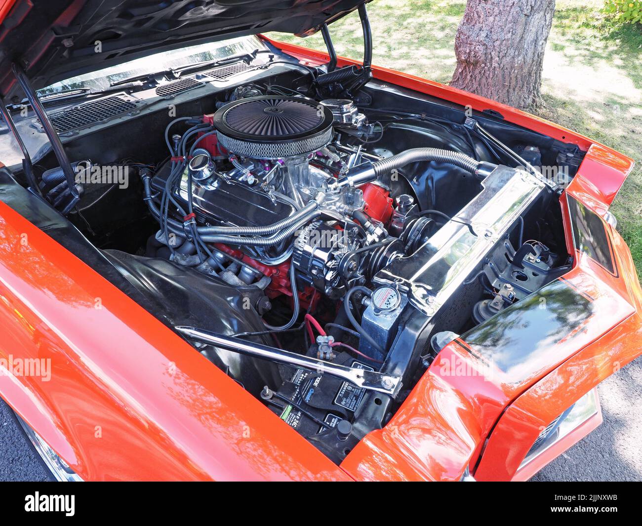 The engine bay of a 1970 General Motors, Chevy Camaro Z28 in Hugger Orange, with a 7.4lt, 454cu V8 conversion. Stock Photo