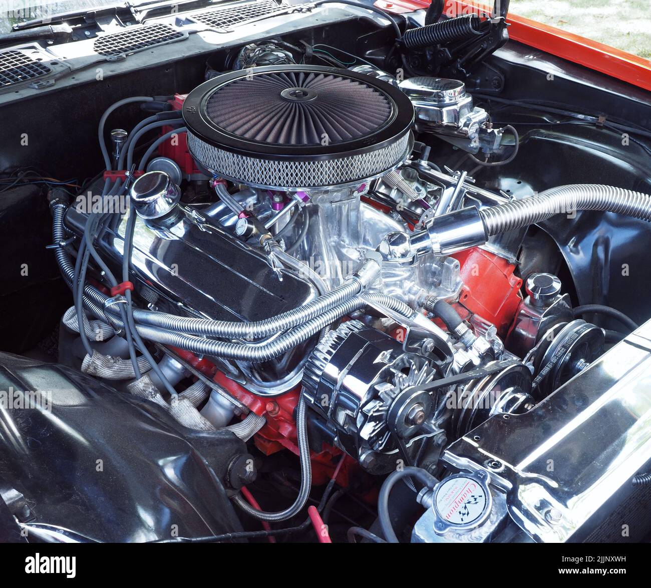 Detail of a 1970, Camero Z28 Chevy 7.4lt, 454 cubic inch, big block V8 petrol engine, Edelbrock manifold, K&N pancake air filter, chrome radiator. Stock Photo