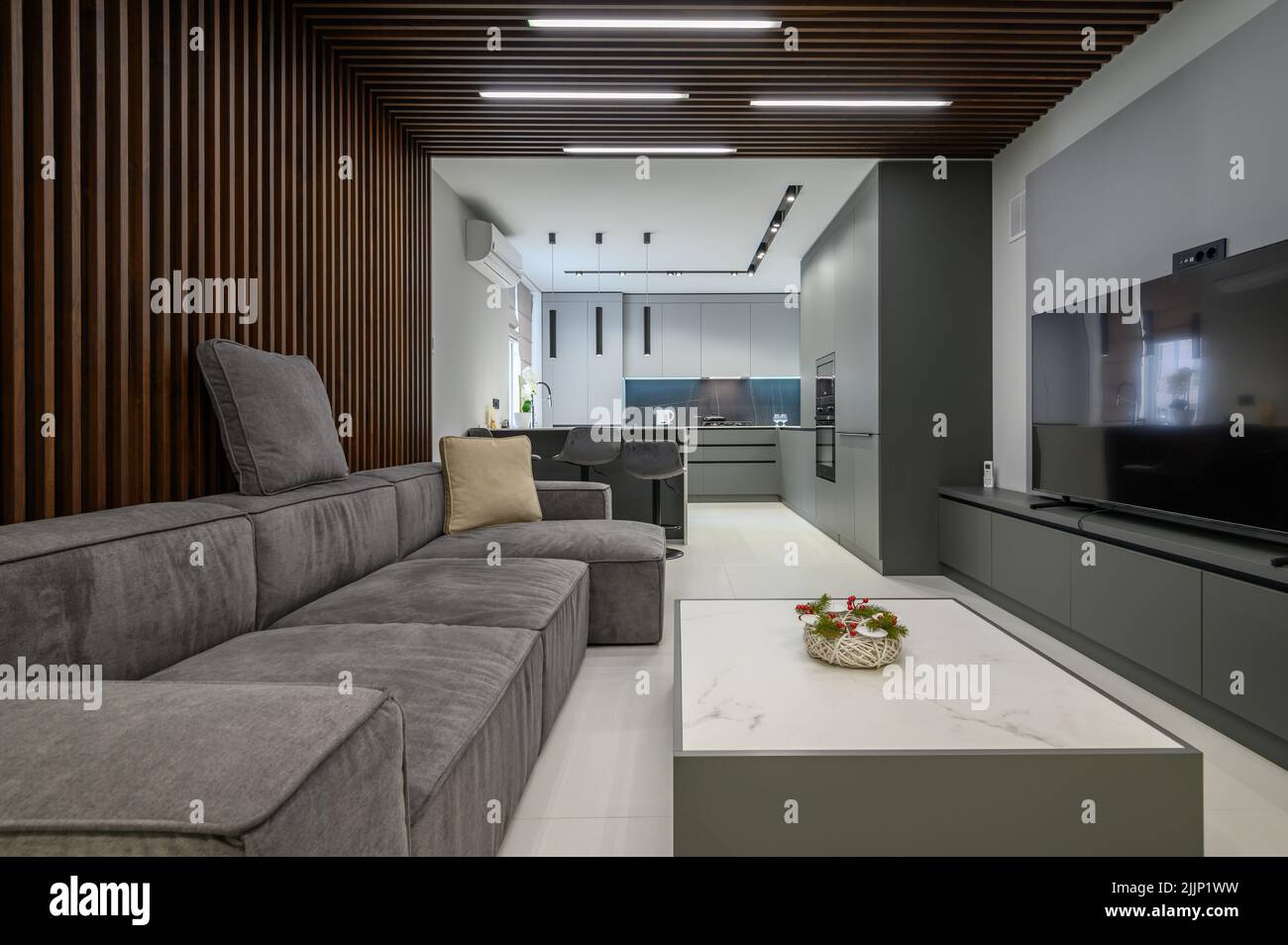 Luxury living room and kitchen in studio apartment Stock Photo - Alamy