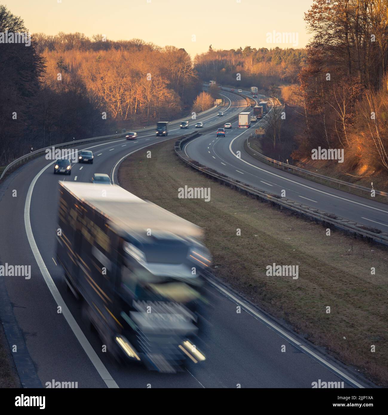 A vertical shot of the cars driving on the autobahn near Giessen, Hessen, Germany. Stock Photo