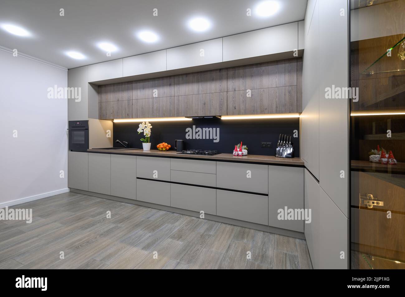 Trendy grey modern kitchen interior with minimalistic furniture Stock ...