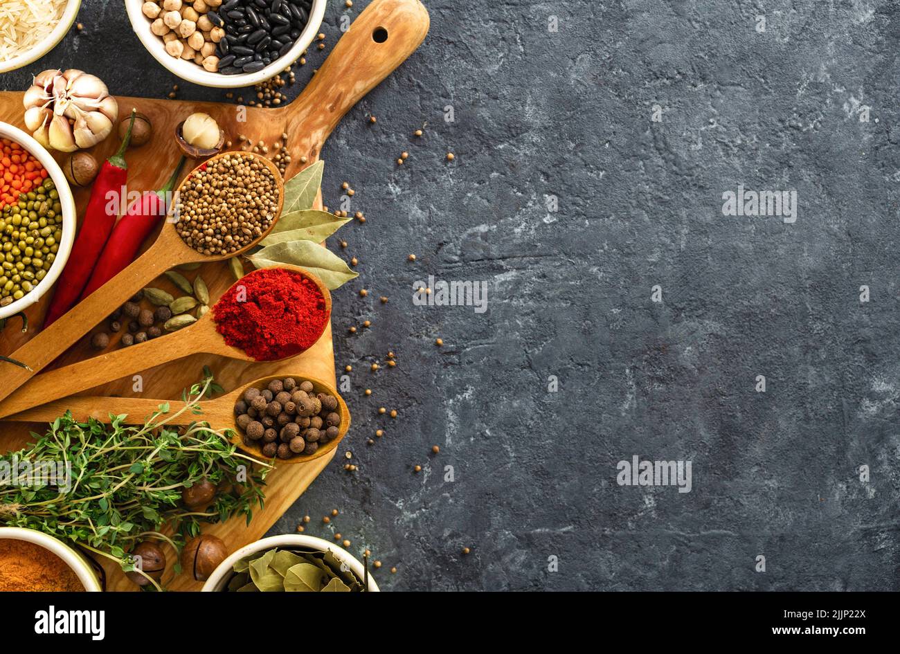 Top view spices, herbs rice and various beans and seasonings for