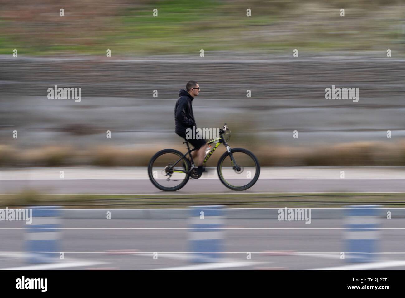 Santiago, Metropolitana, Chile. 26th July, 2022. A man rides a bicycle in Santiago, Chile. (Credit Image: © Matias Basualdo/ZUMA Press Wire) Stock Photo