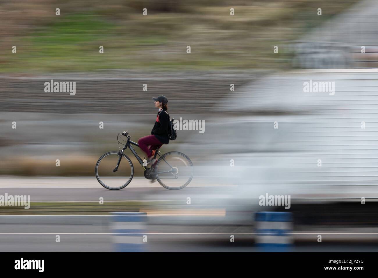 Santiago, Metropolitana, Chile. 26th July, 2022. A woman rides a bicycle in Santiago, Chile. (Credit Image: © Matias Basualdo/ZUMA Press Wire) Stock Photo