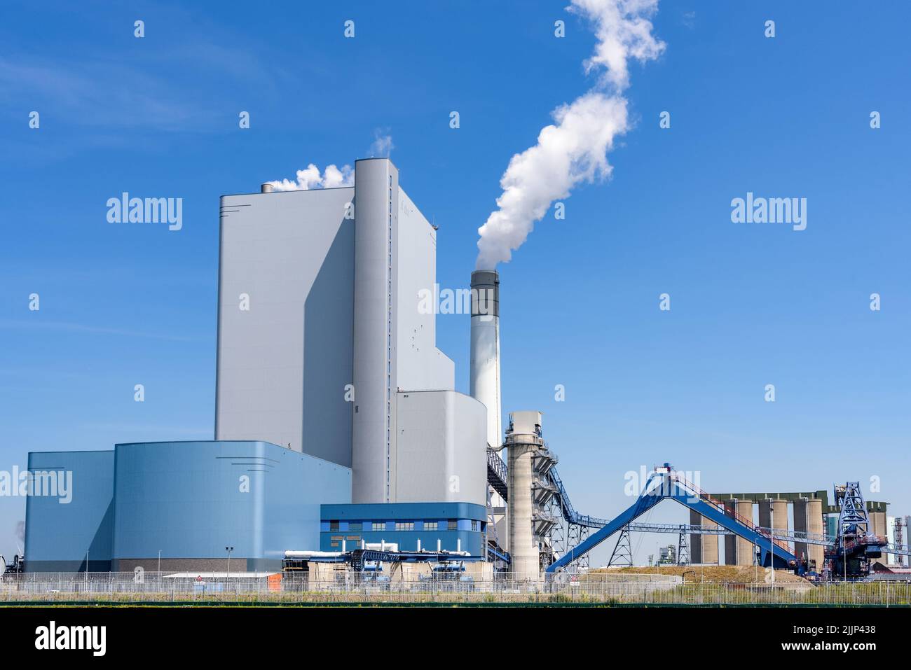 View of a large coal and biomass power plant on a clear summer day Stock Photo