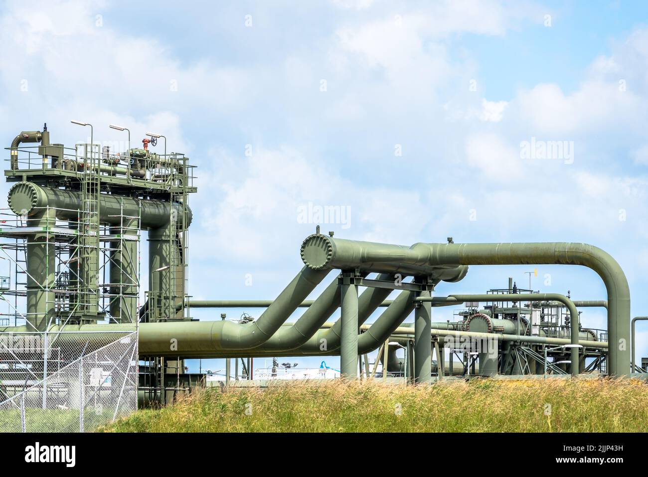 Gas pipelines and valves at a natural gas extraction site. Groningen gas field. Stock Photo