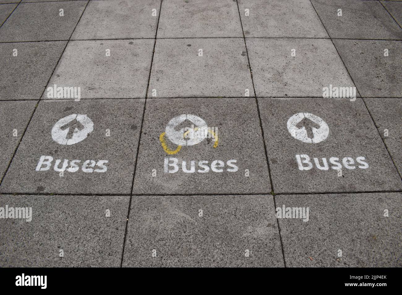 Sign on the pavement at Station Square Milton Keynes: 'Buses'. Stock Photo