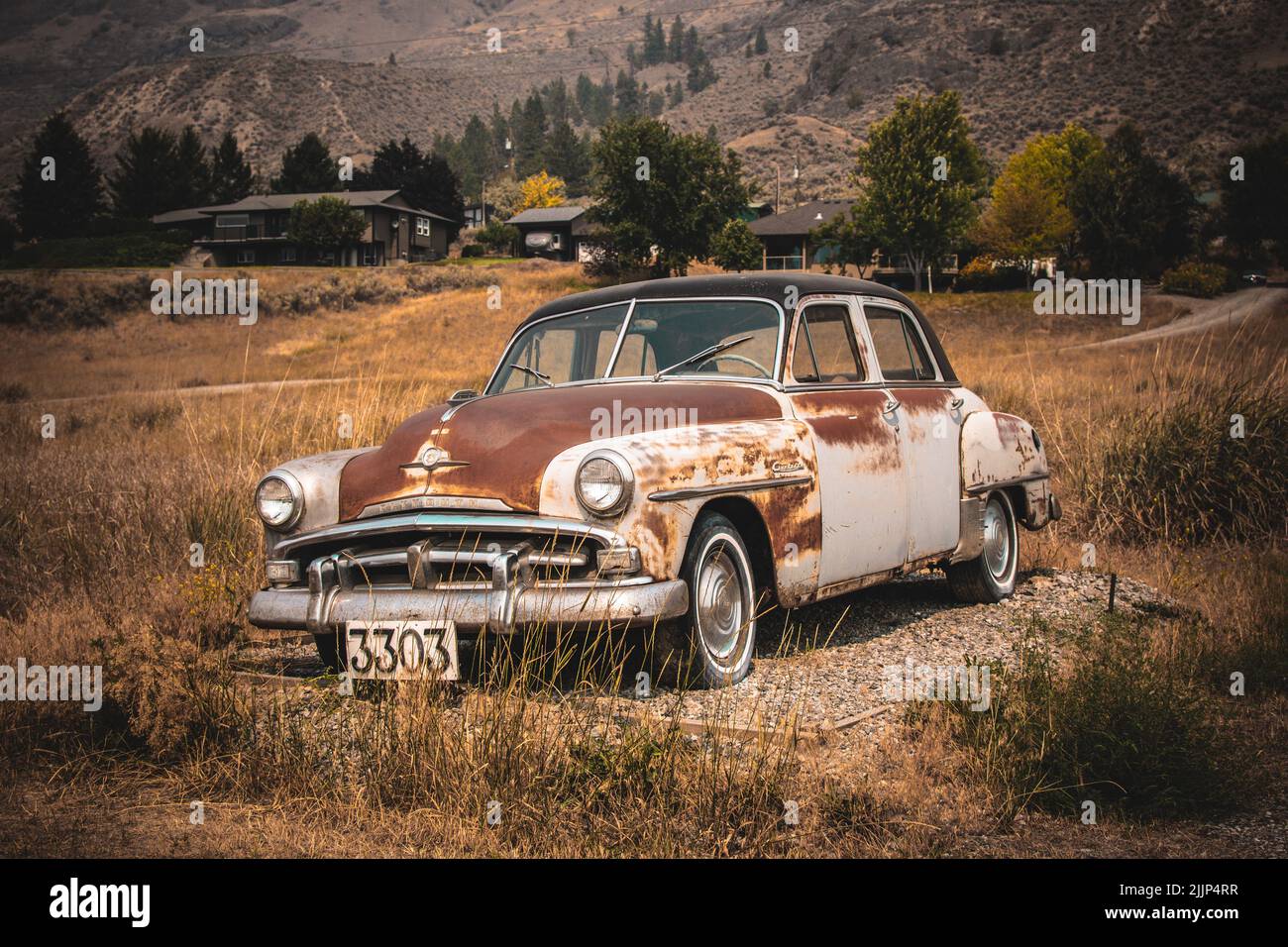 An old rusted car abandoned in the field of Kamloops, Canada Stock