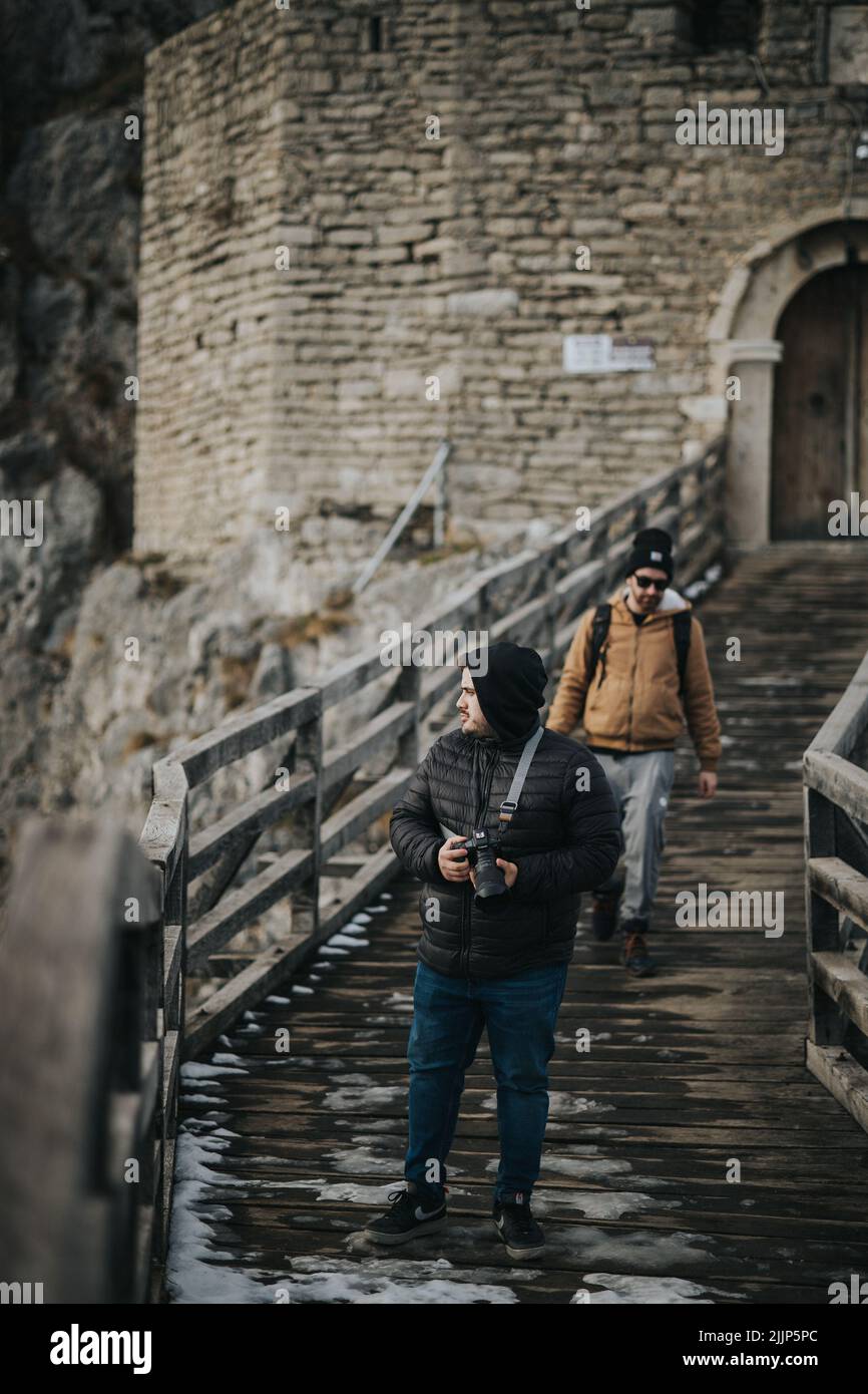 A Two young males taking photos outdoors Stock Photo
