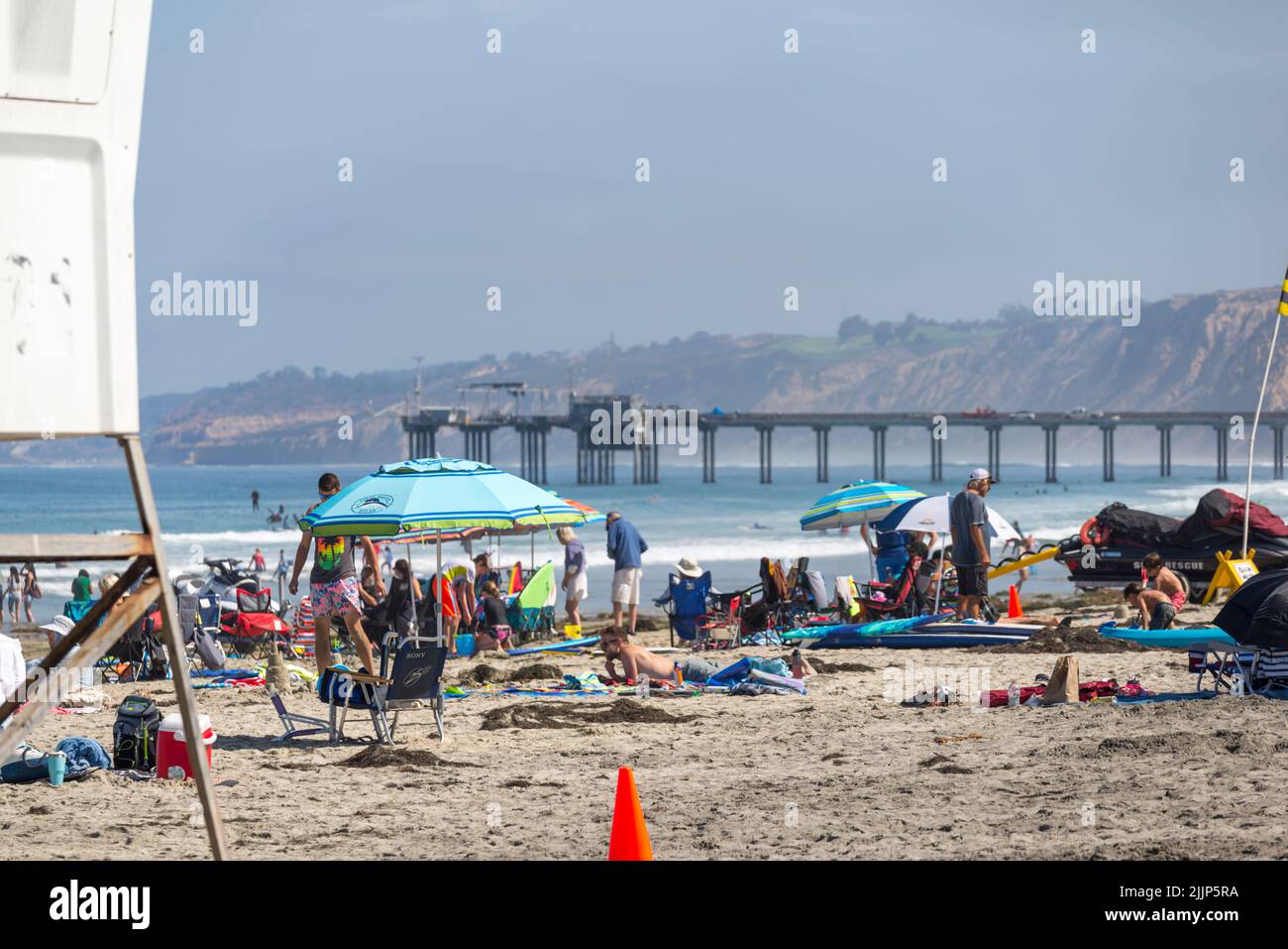 A summer day at La Jolla Shores Beach. La Jolla, San Diego, California, USA. Scripps Pier in the background. Stock Photo