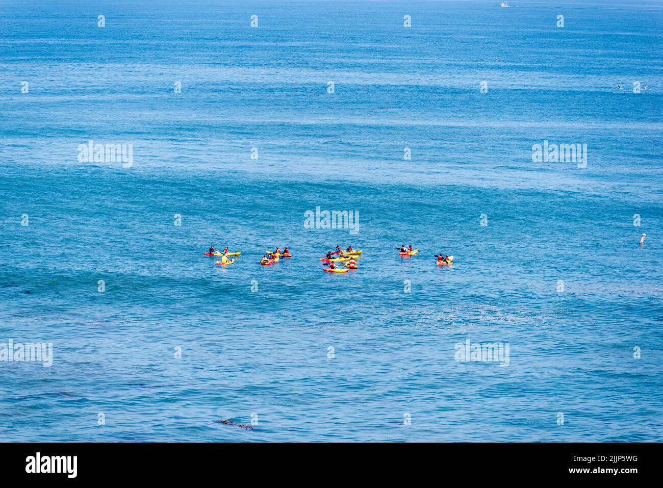 A group of kayakers in the ocean. La Jolla, San Diego, California, USA. Stock Photo