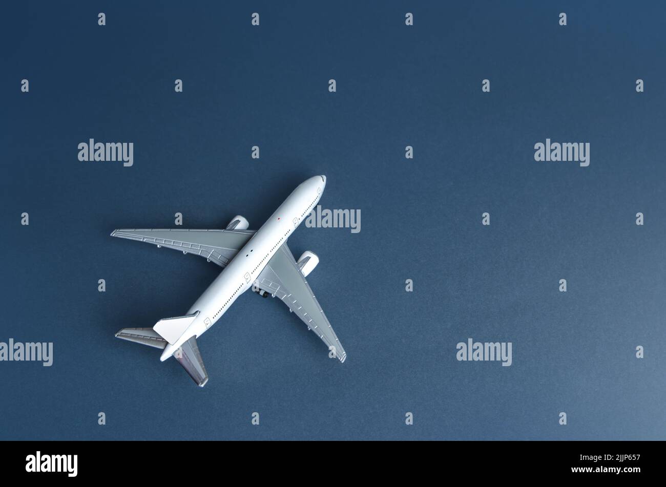 White plane. Cargo or passenger airliner. Business and tourism. Airline operators, air carriers. World communication and commercial flights. Travel. L Stock Photo