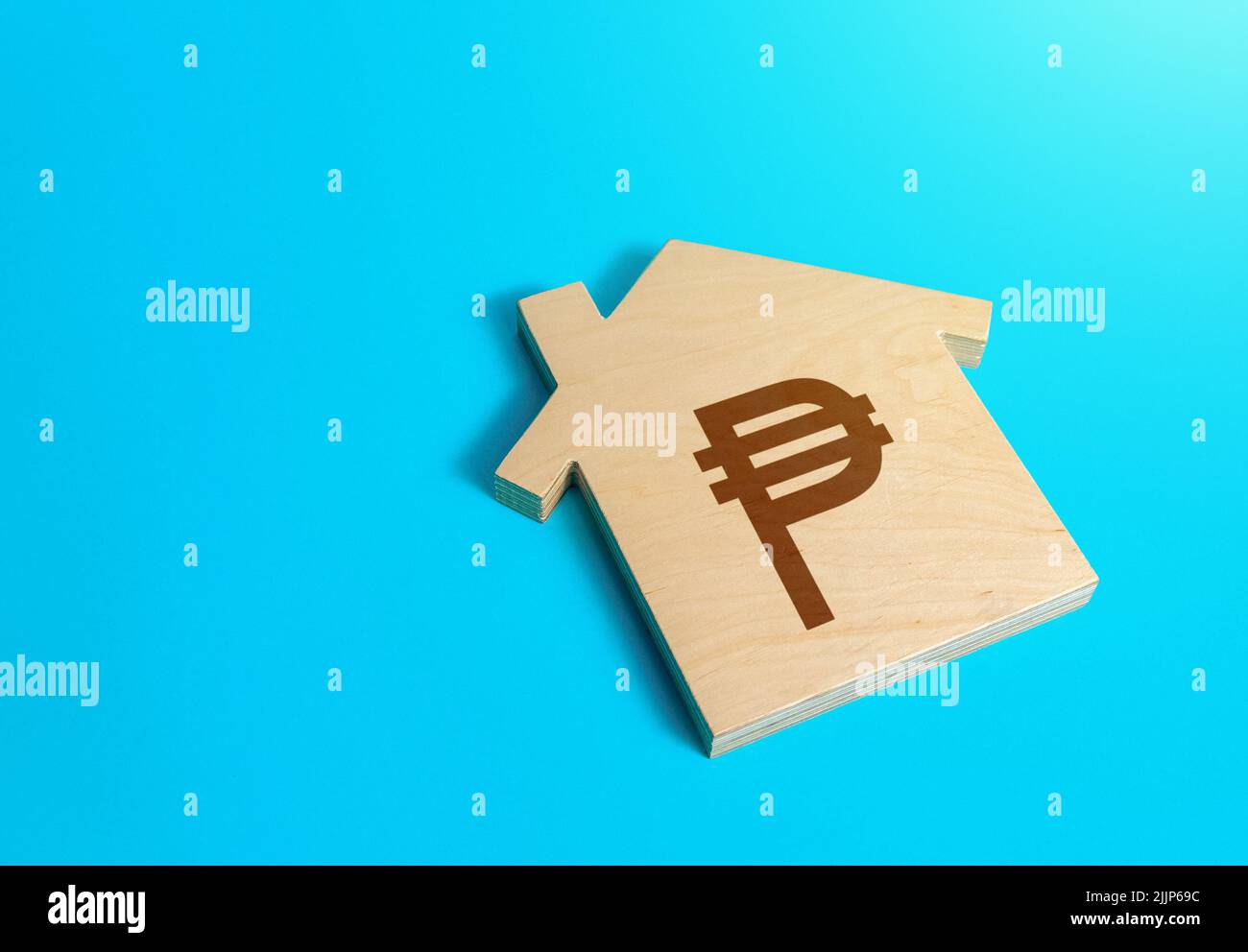 House with a philippine peso symbol. Solving housing problems, deciding buy or rent real estate. Search for options, choice of residential buildings. Stock Photo