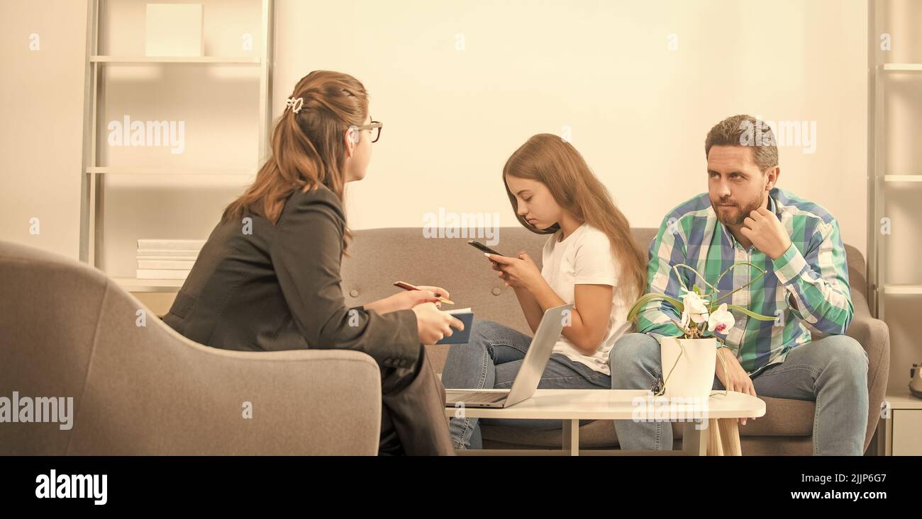 phone addicted kid with daddy sitting at psychologist solving problem, relationship Stock Photo
