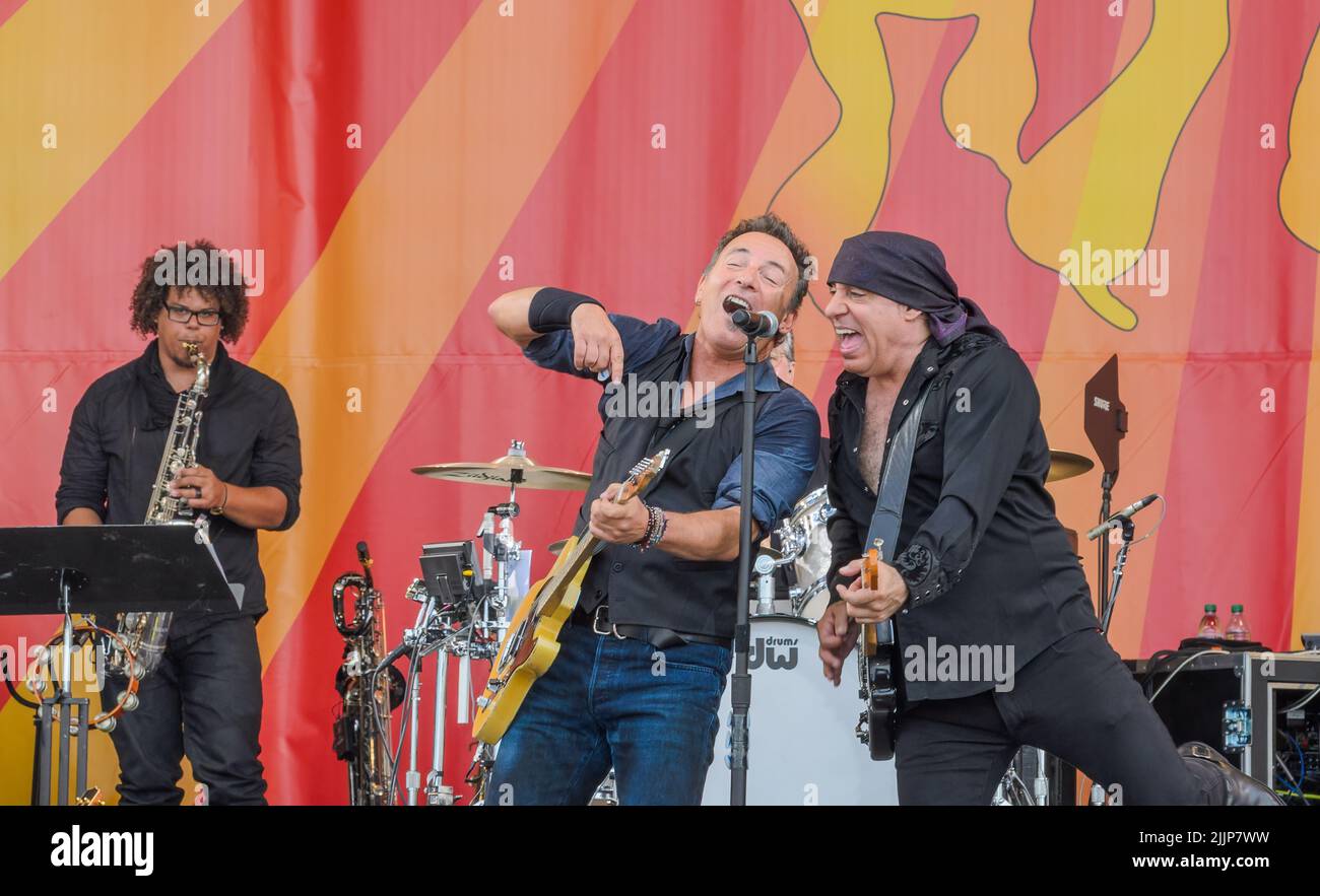 NEW ORLEANS, LA, USA - 4/29/12 : Bruce Springsteen and Steve Van Zandt share microphone as Jake Clemons plays saxophone and Max Weinberg plays drums Stock Photo