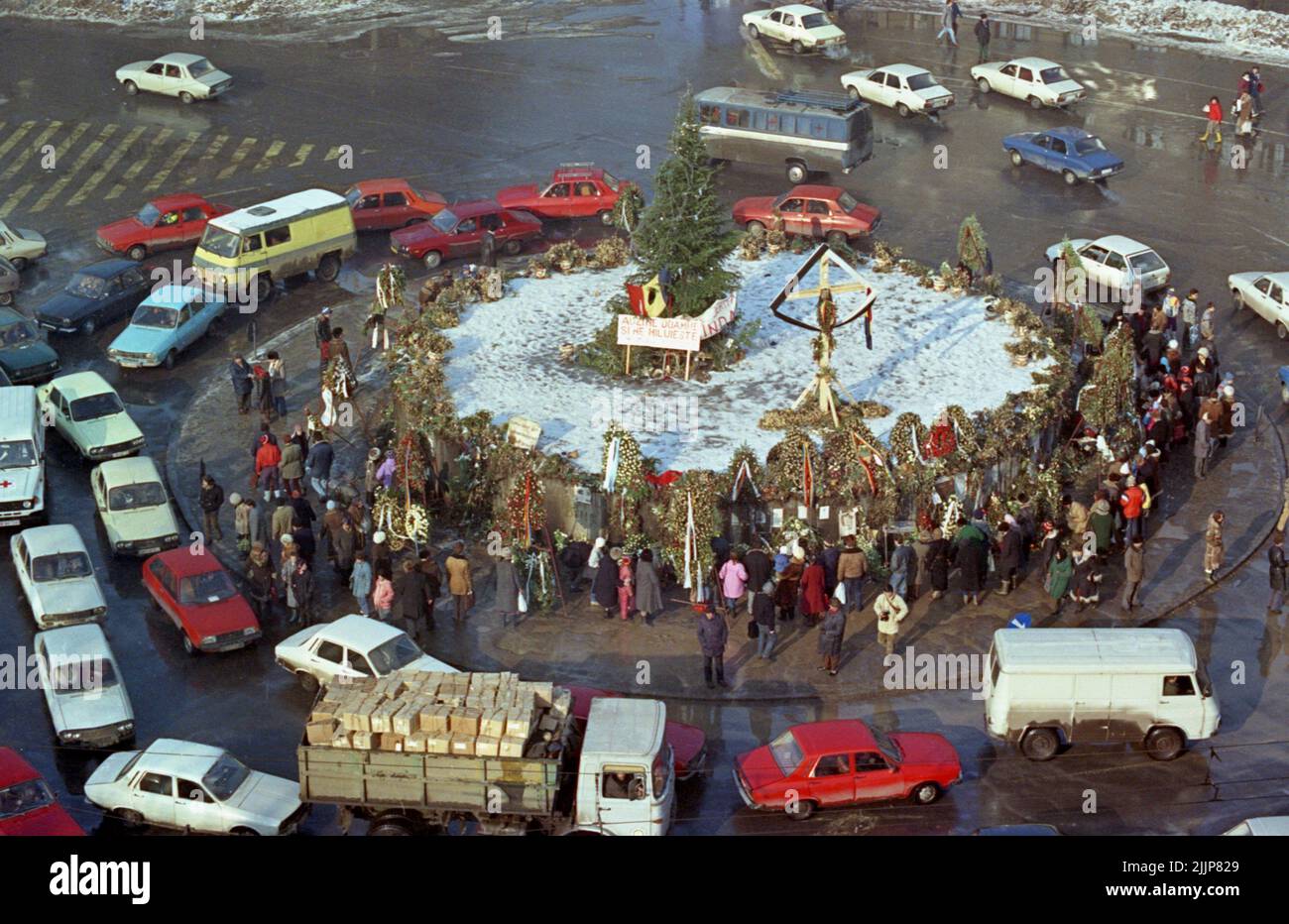 Bucharest, Romania, January 1990. Memorial for the victims of the Romanian anticommunist revolution of December 1989 in the center of the University Square, one of the key points in the uprising. People gathered daily in the weeks following the event, to lay flowers, lit up candles, and pray. Stock Photo
