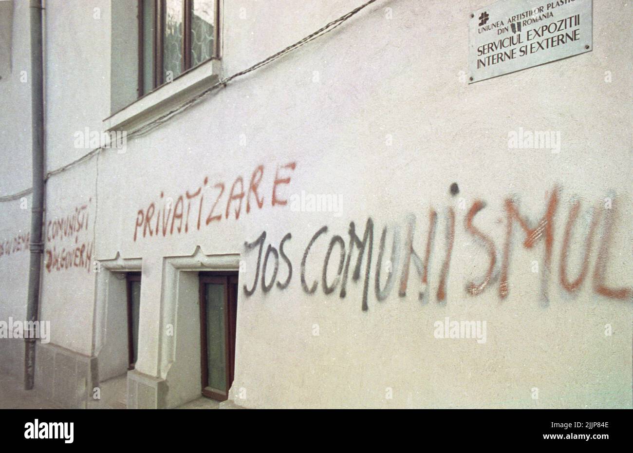 Bucharest,  Messages written by citizens in downtown Bucharest, Romania right after the anticommunist revolution of December 1989: 'Down with communism', 'Private enterprise', 'Down with the demagogue communists in the Government'. Stock Photo