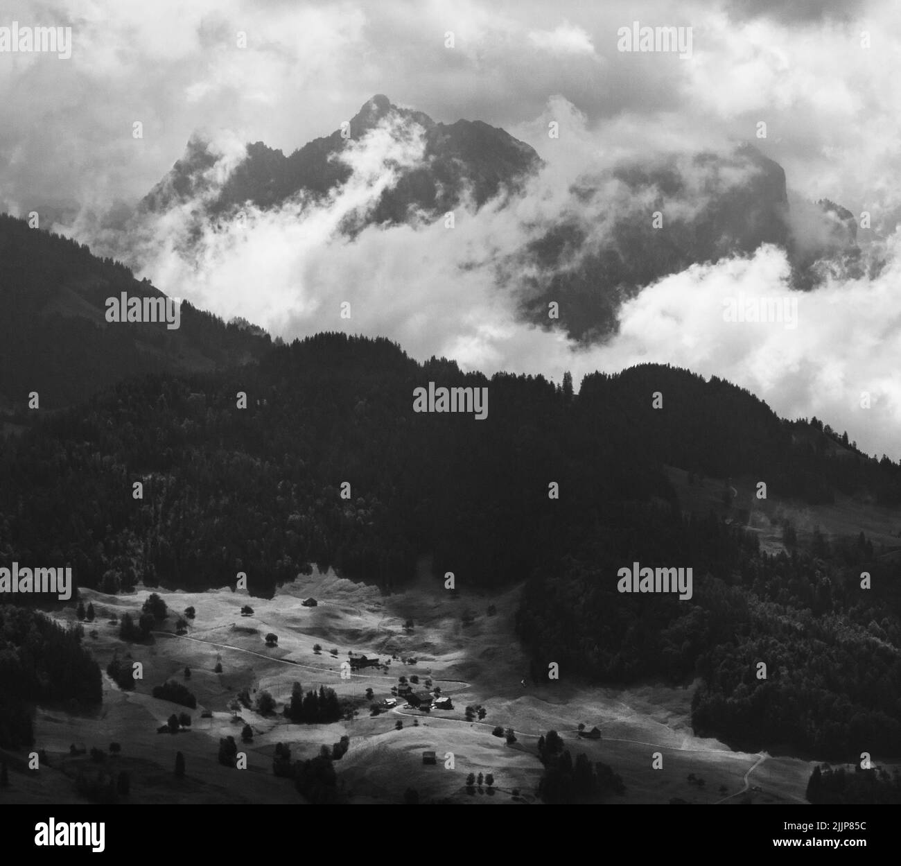 A Black and white snowy mountains in the fog Stock Photo - Alamy