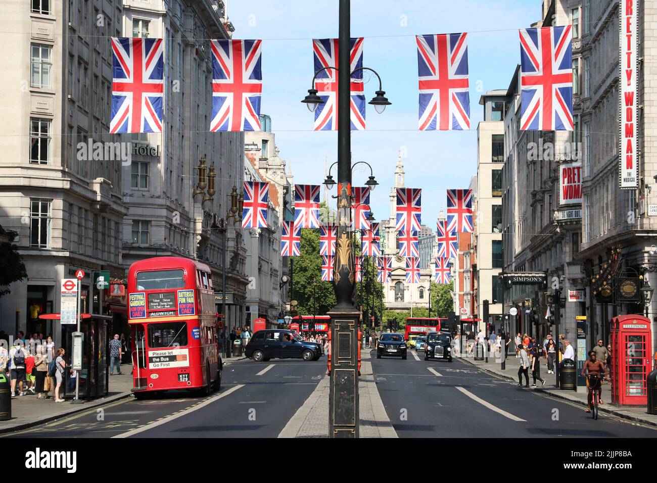 THE STRAND IN LONDON WITH RED DOUBLE DECKER BUS Stock Photo