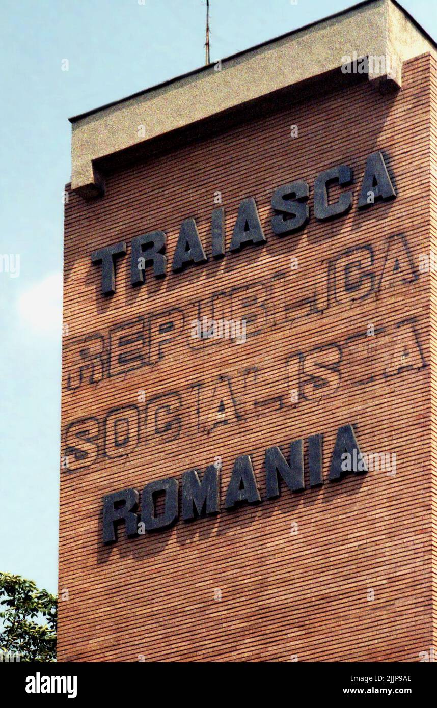 Romania, 1990. Facade of a factory with the slogan 'Long live Romania', after the removal of the words 'Socialist republic' following the anti-communist revolution of 1989. Stock Photo
