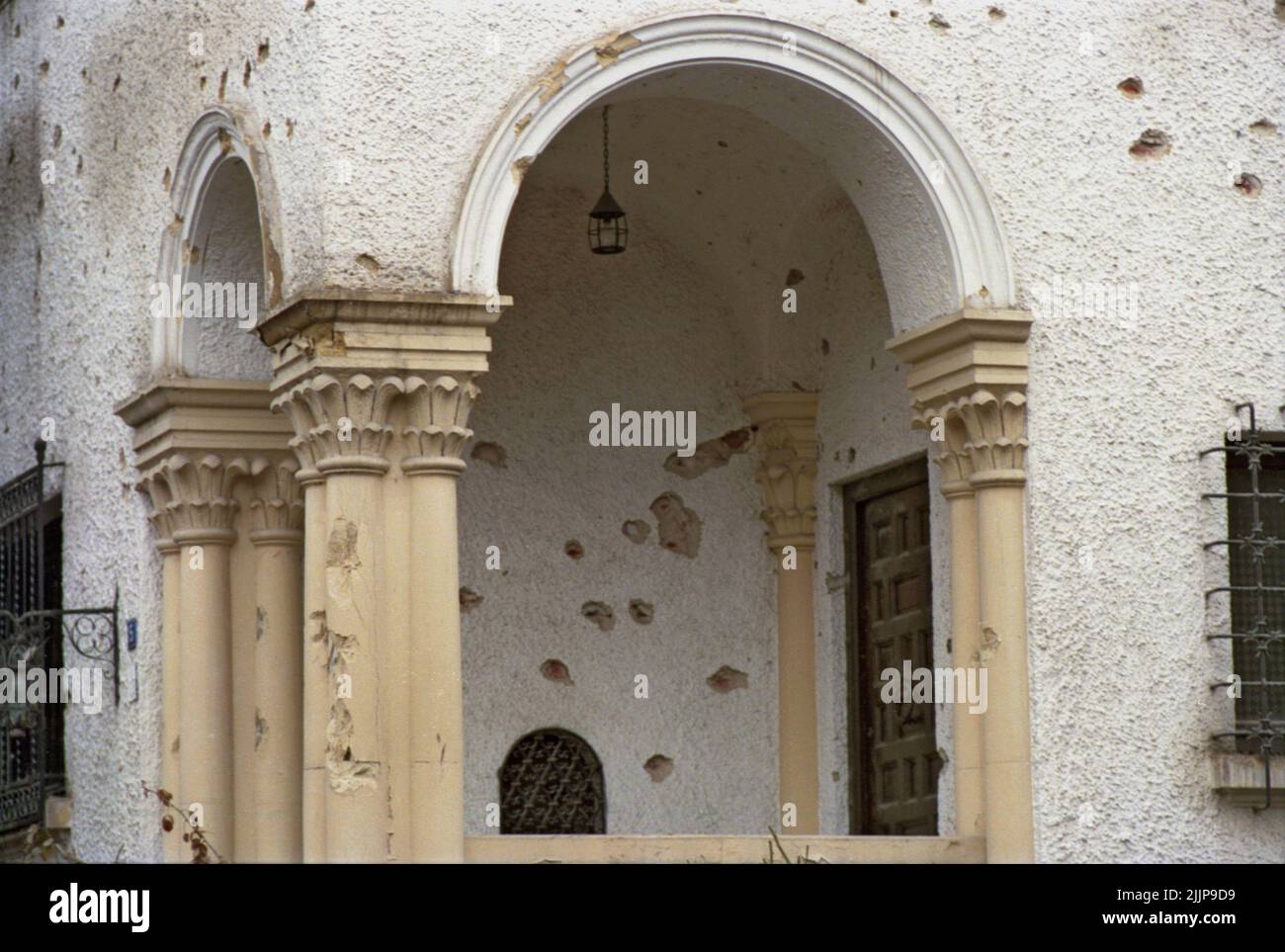 Bucharest, Romania, January 1990. The residence of the British ambassador (near the headquarters of the public Romanian television station), deteriorated by the gunfire during the anticommunist revolution of December 1989. Stock Photo