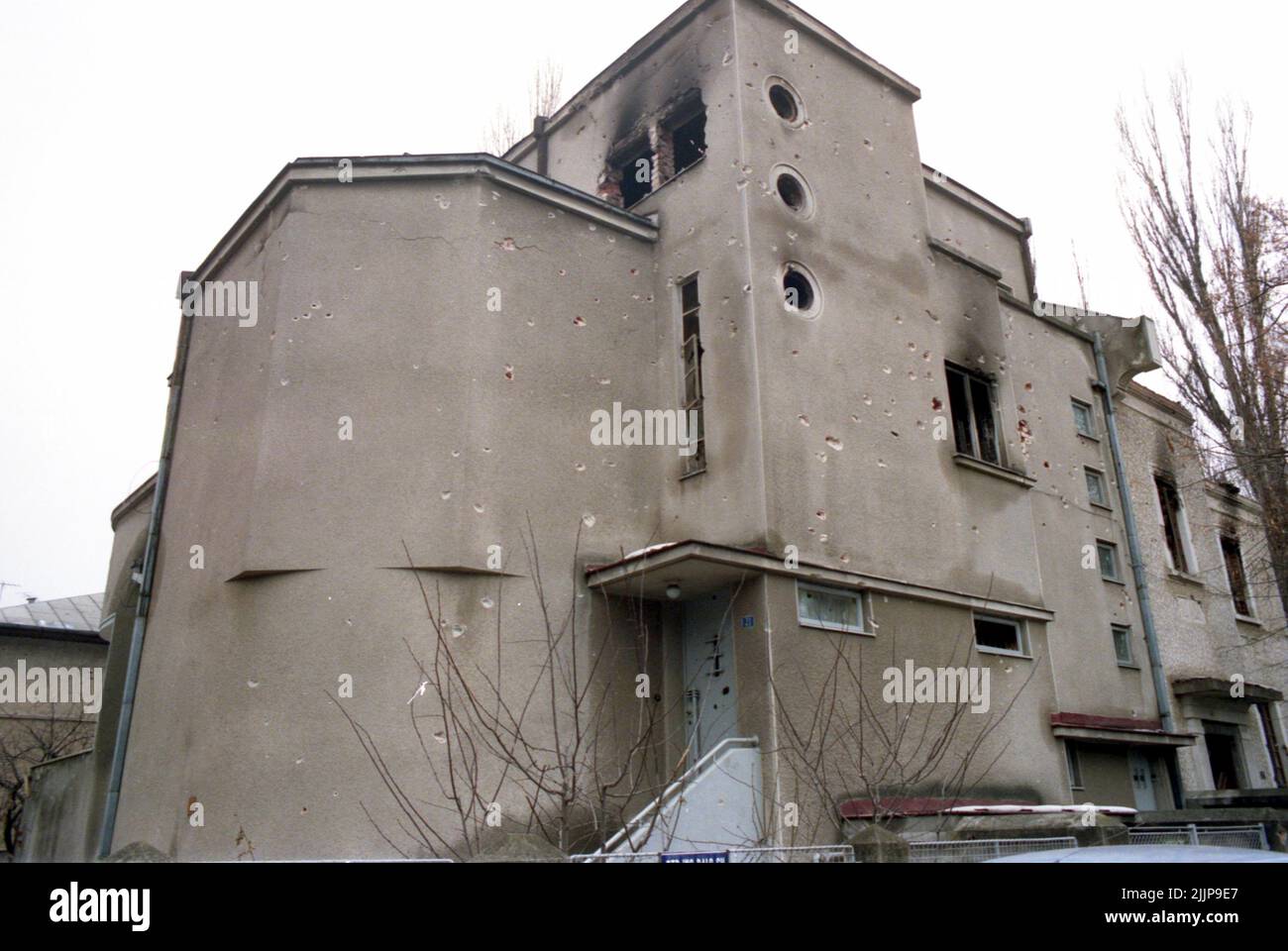 Bucharest, Romania, January 1990. Building on Pangratti Street, near the headquarters of the public Romanian television station, deteriorated by the gunfire during the anticommunist revolution of December 1989. Stock Photo