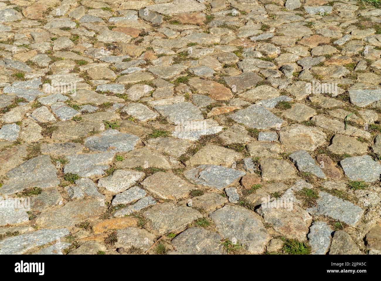 A high-angle shot of a stone ground texture on a sunny day Stock Photo