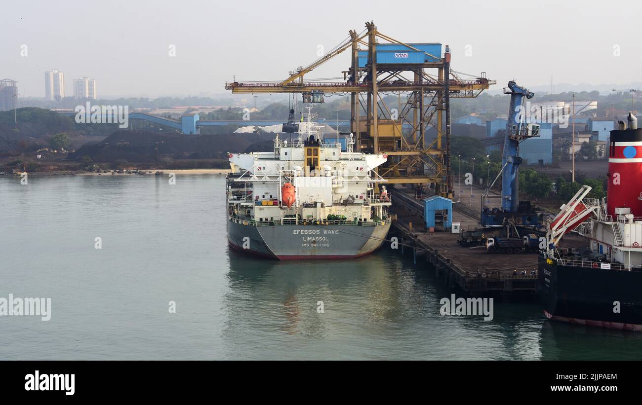 The photo shows an industrial ship on a loading crane in the port of New Mangalore, India Stock Photo