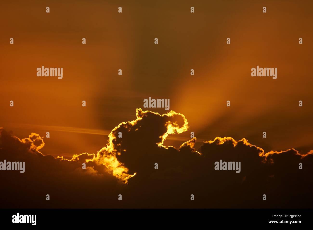A beautiful scenery of the sunset sky with clouds Stock Photo - Alamy