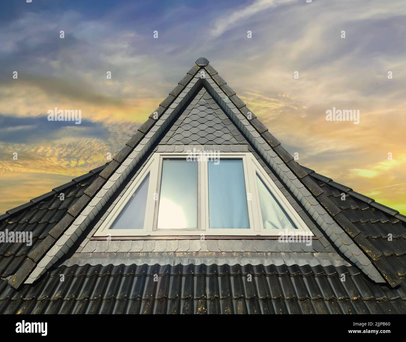 Open roof window in velux style with black roof tiles Stock Photo Alamy