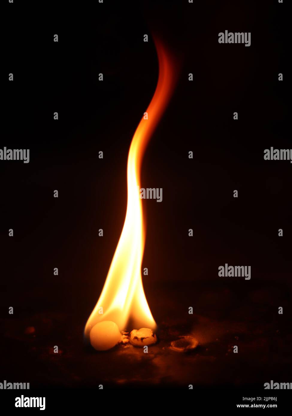 A vertical shot of the camphor burning Stock Photo Alamy