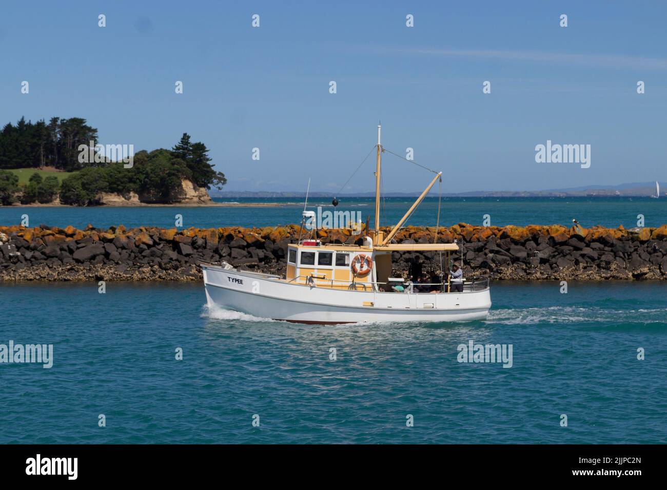 A fishing boat during summertime in Whangaparaoa, New Zealand Stock Photo