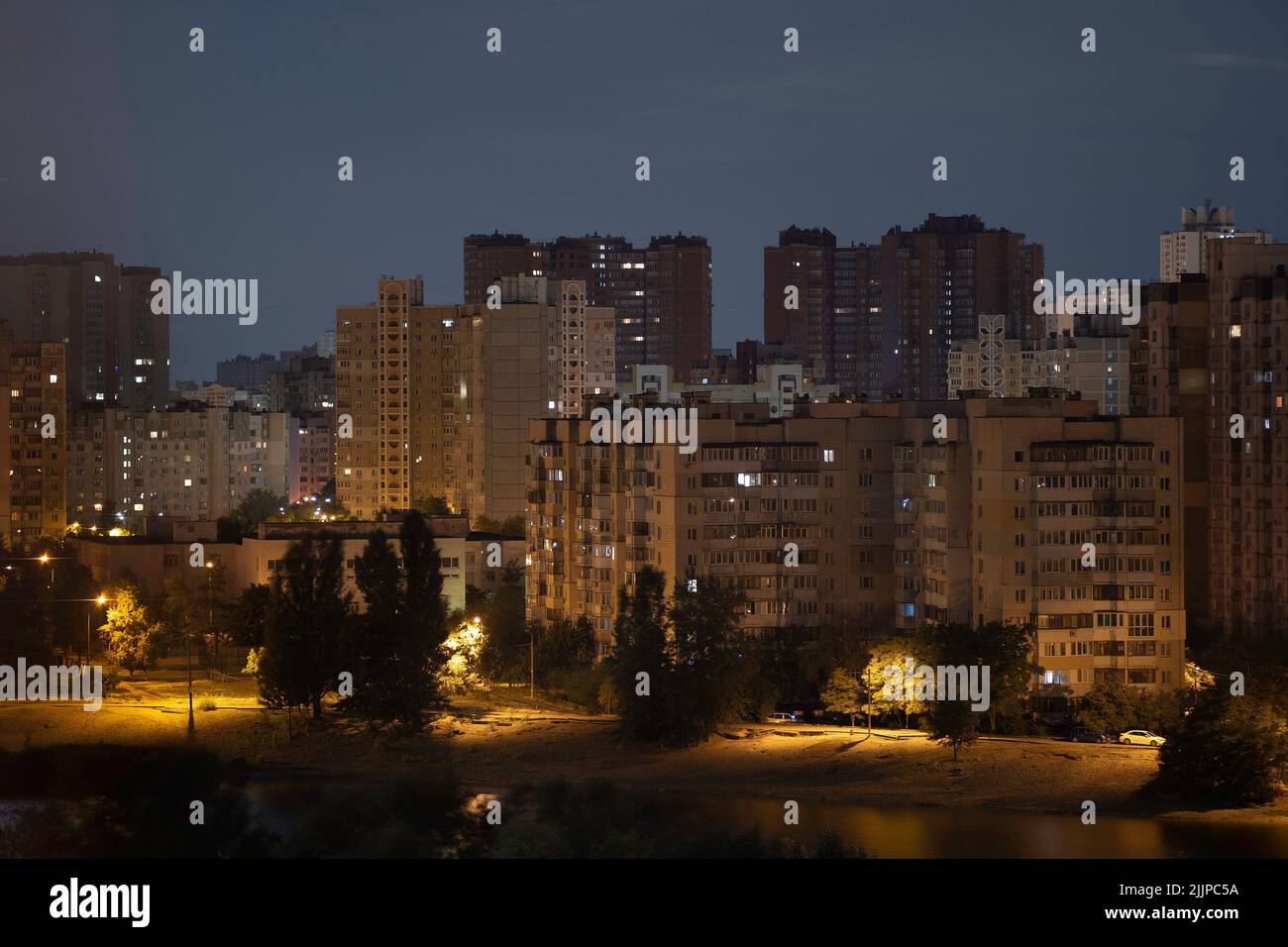 Night cityscape of the big city. Awesome bright, multi colored light at