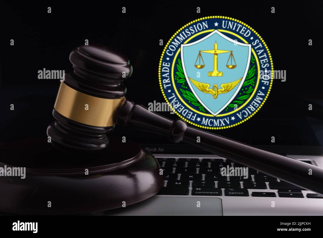 Court gavel placed on laptop with blurred Meta Platforms company logo on the screen. Concept. Stafford, United Kingdom, July 27, 2022 Stock Photo