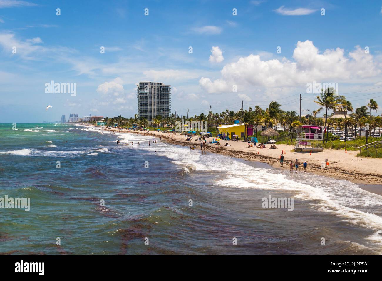 Dania Beach, Florida, USA - July 17, 2022: View of public beach of Dania Beach landscape in summer windy afternoon Stock Photo