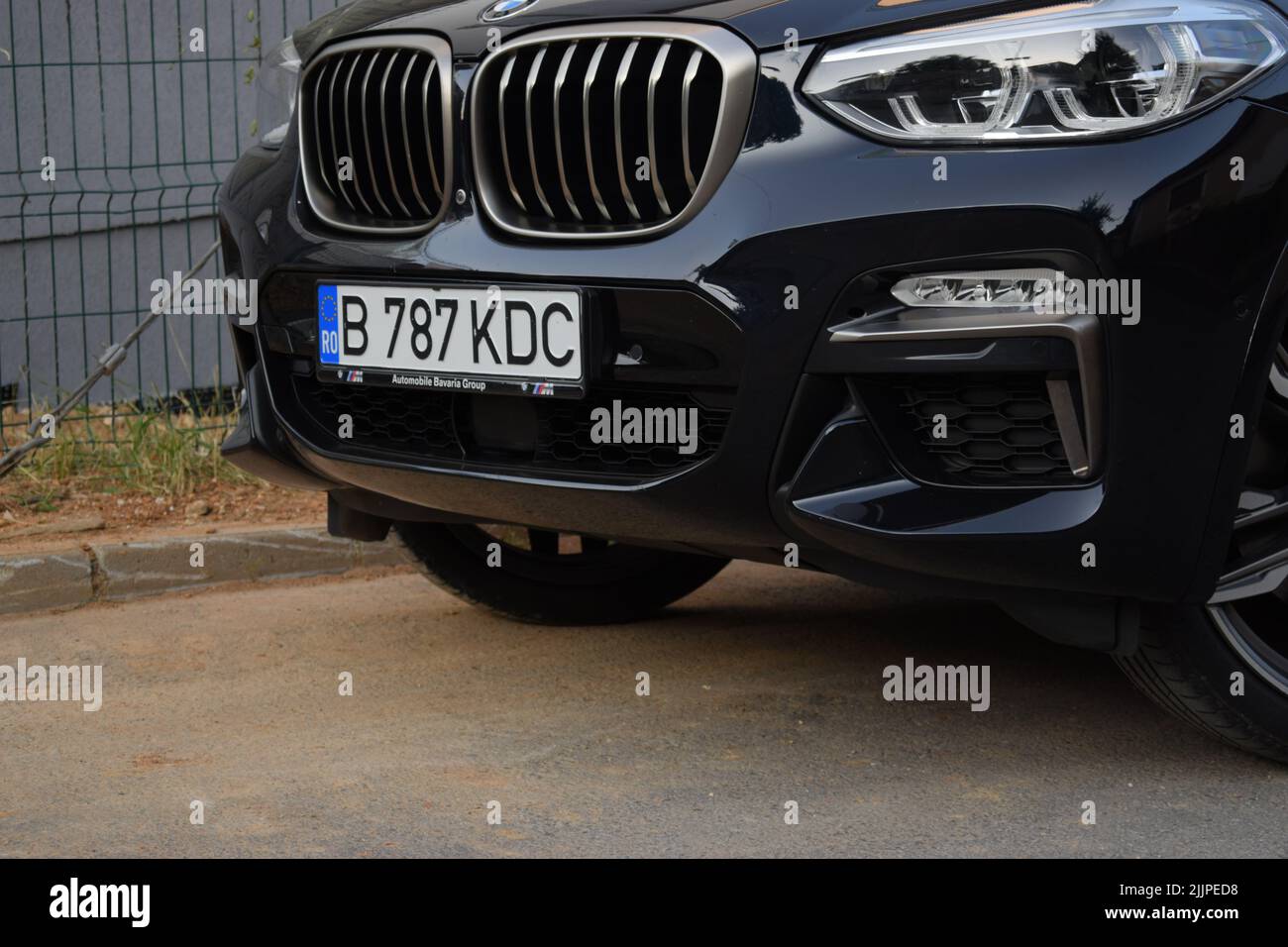 A view of a black BMW car on the road Stock Photo
