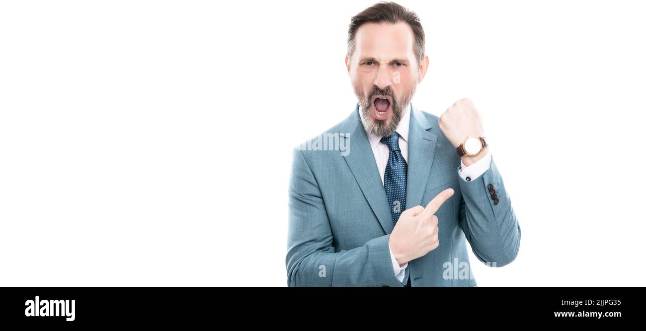 Man face portrait, banner with copy space. angry mature director in suit pointing finger on time on watch isolated on white, late. Stock Photo