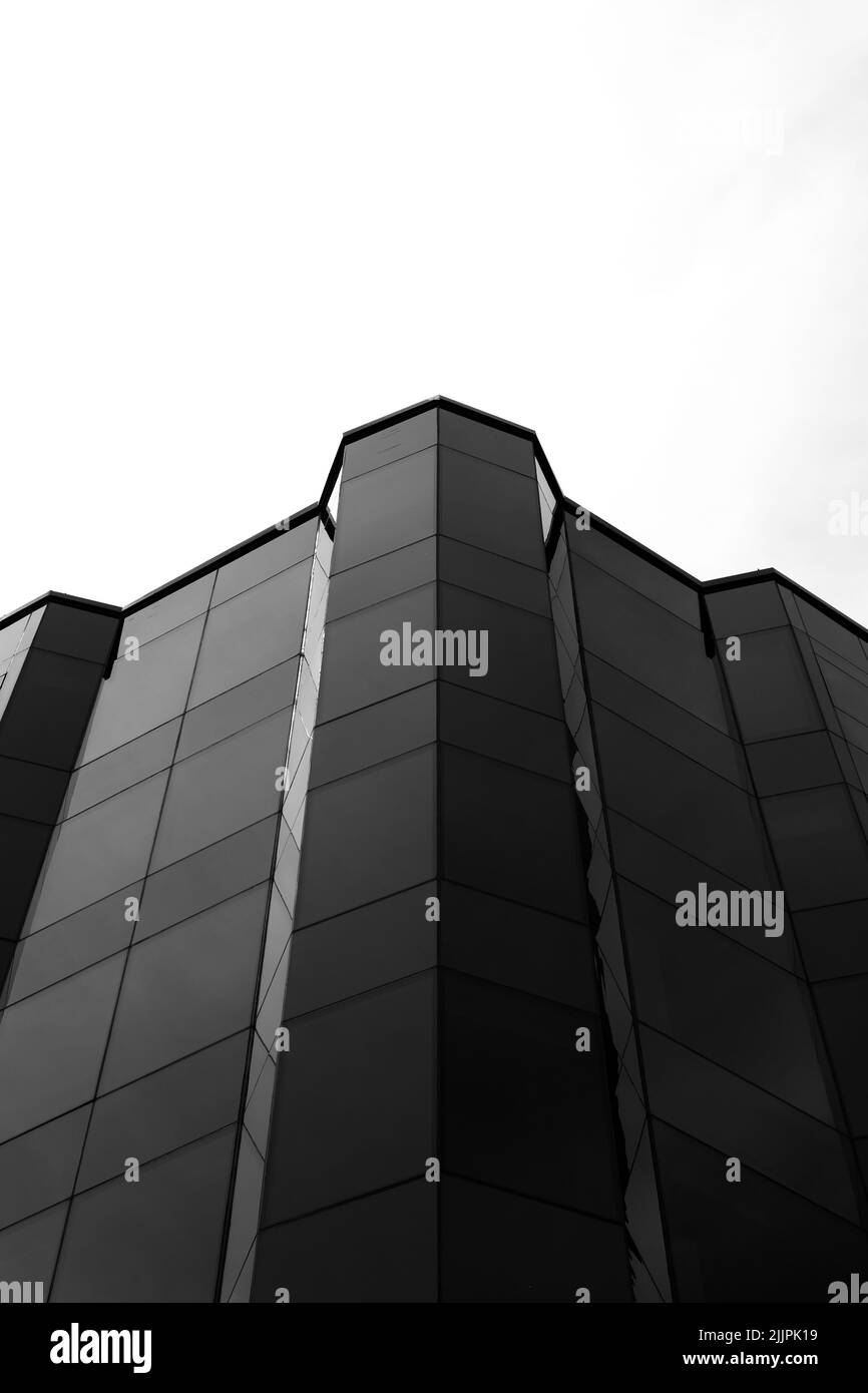 A low angle shot of a modern building in black and white Stock Photo ...