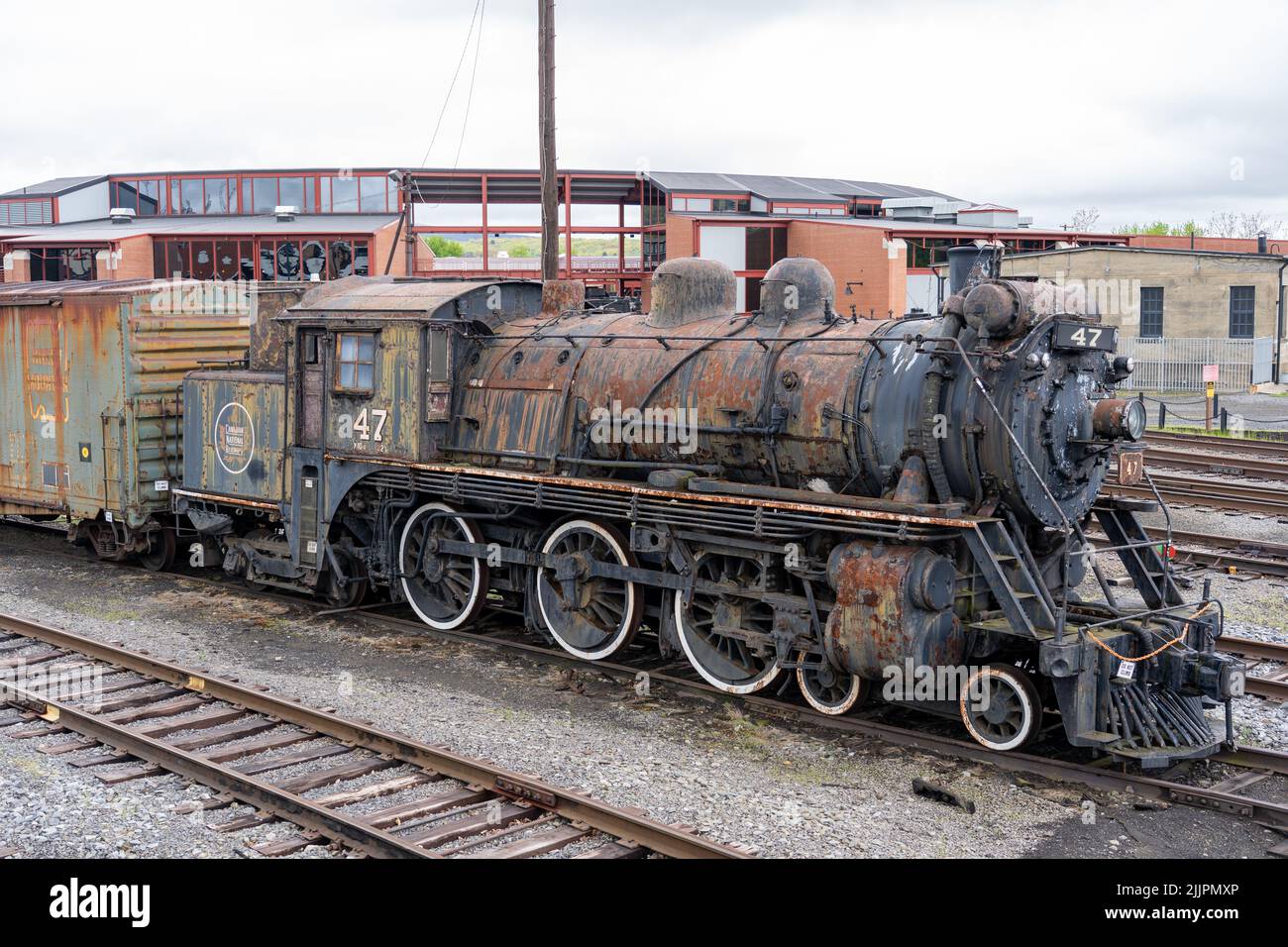 The old and historic steam train on track in a museum Stock Photo - Alamy