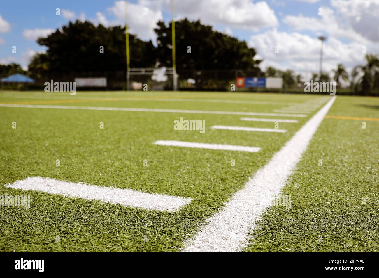 A view of painted lines on a football field on a sunny day Stock Photo