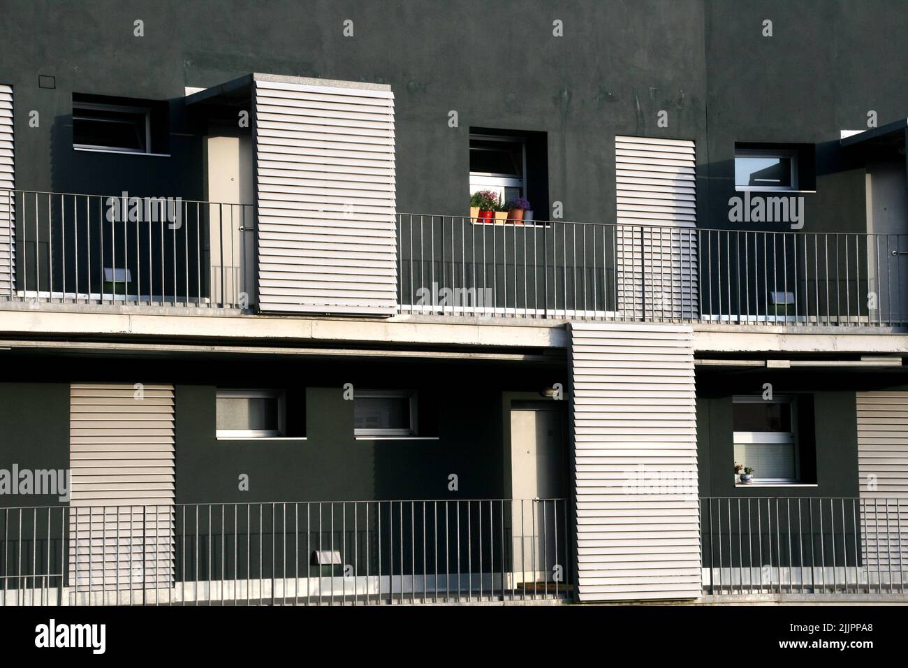 A beautiful view of a modern apartment building with balconies in ...