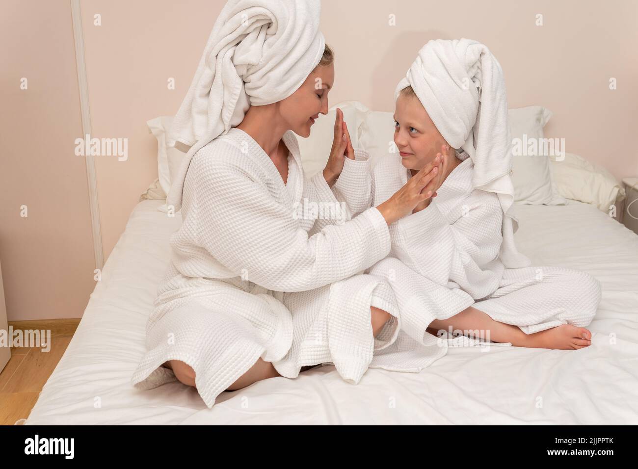 Daughter dries smiling love bath mom thinks elbows smile copyspace, for white morning for lifestyle for skin caucasian, little bathing. Care funny Stock Photo