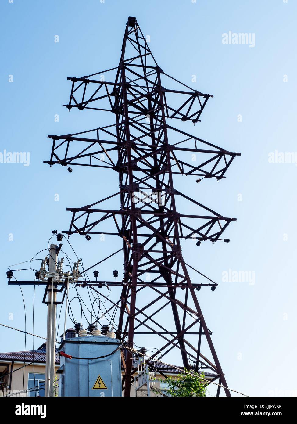 Electric pole near the transformer box. Old electric pole. Electric