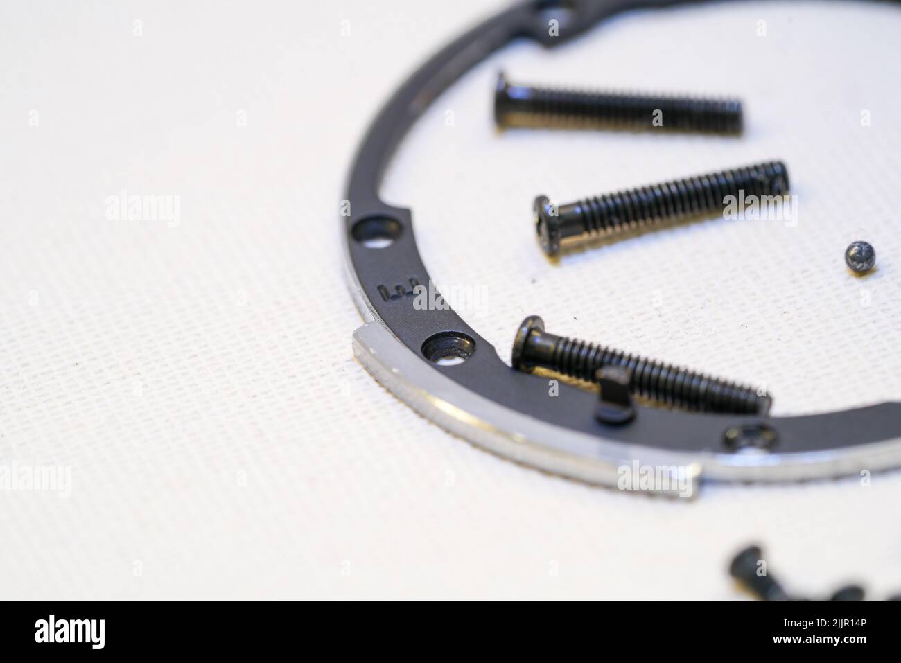 The disassembled lens from the camera and screws Stock Photo Alamy