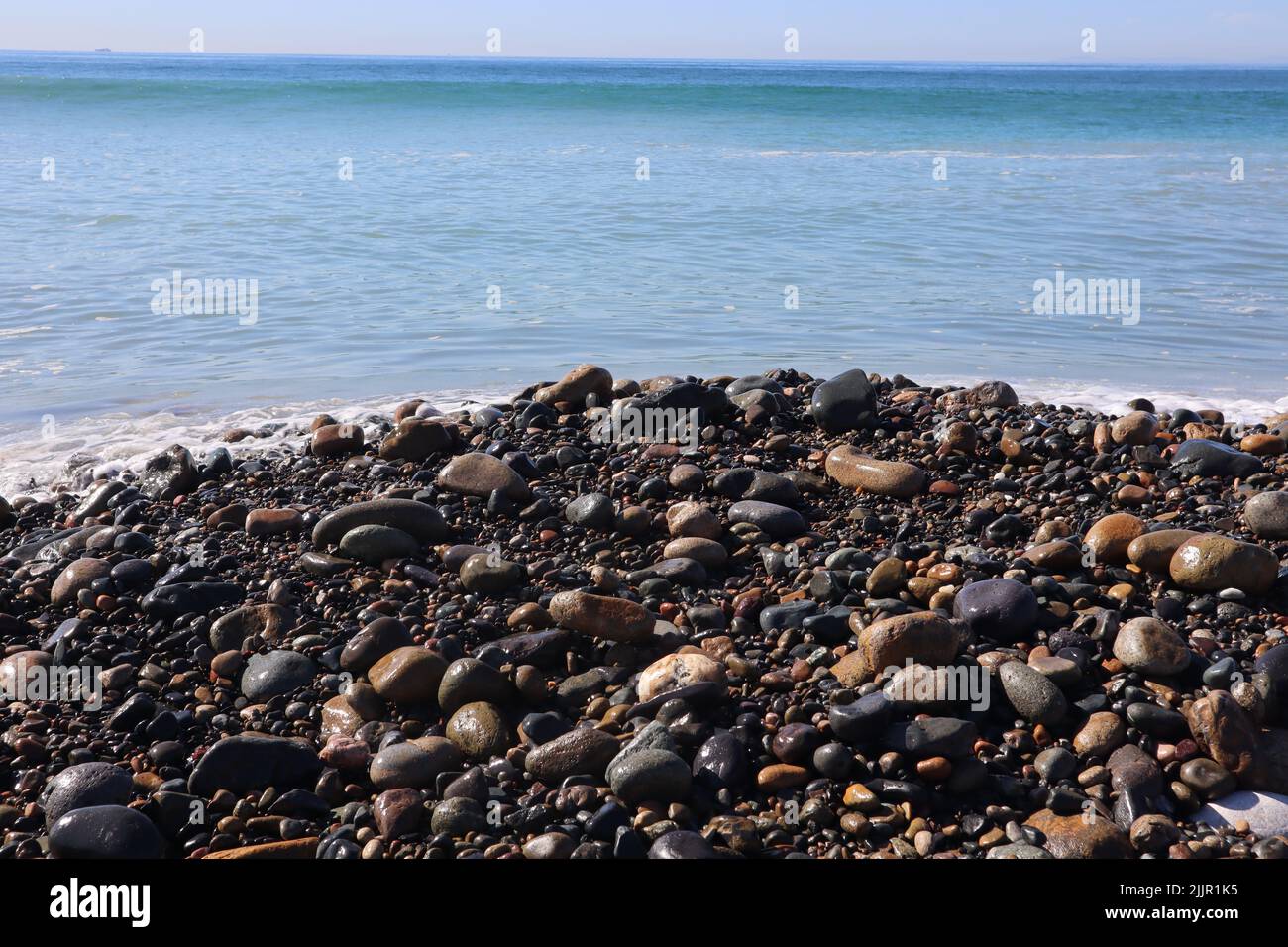 A natural view of the rocky beach in San Clemente, California, USA Stock Photo