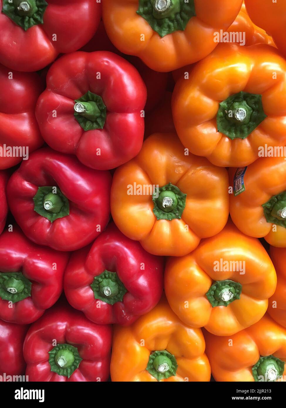 A closeup shot of pile of yellow and red pepper on the farmers market in California. Stock Photo