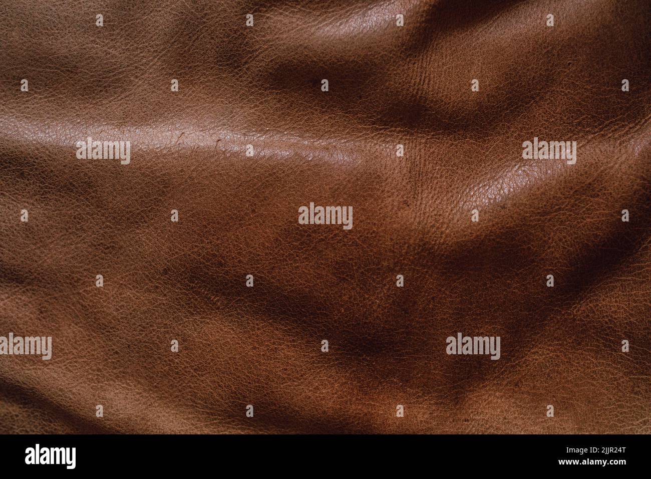 Medium brown leather couch sofa cushion material textu Stock Photo
