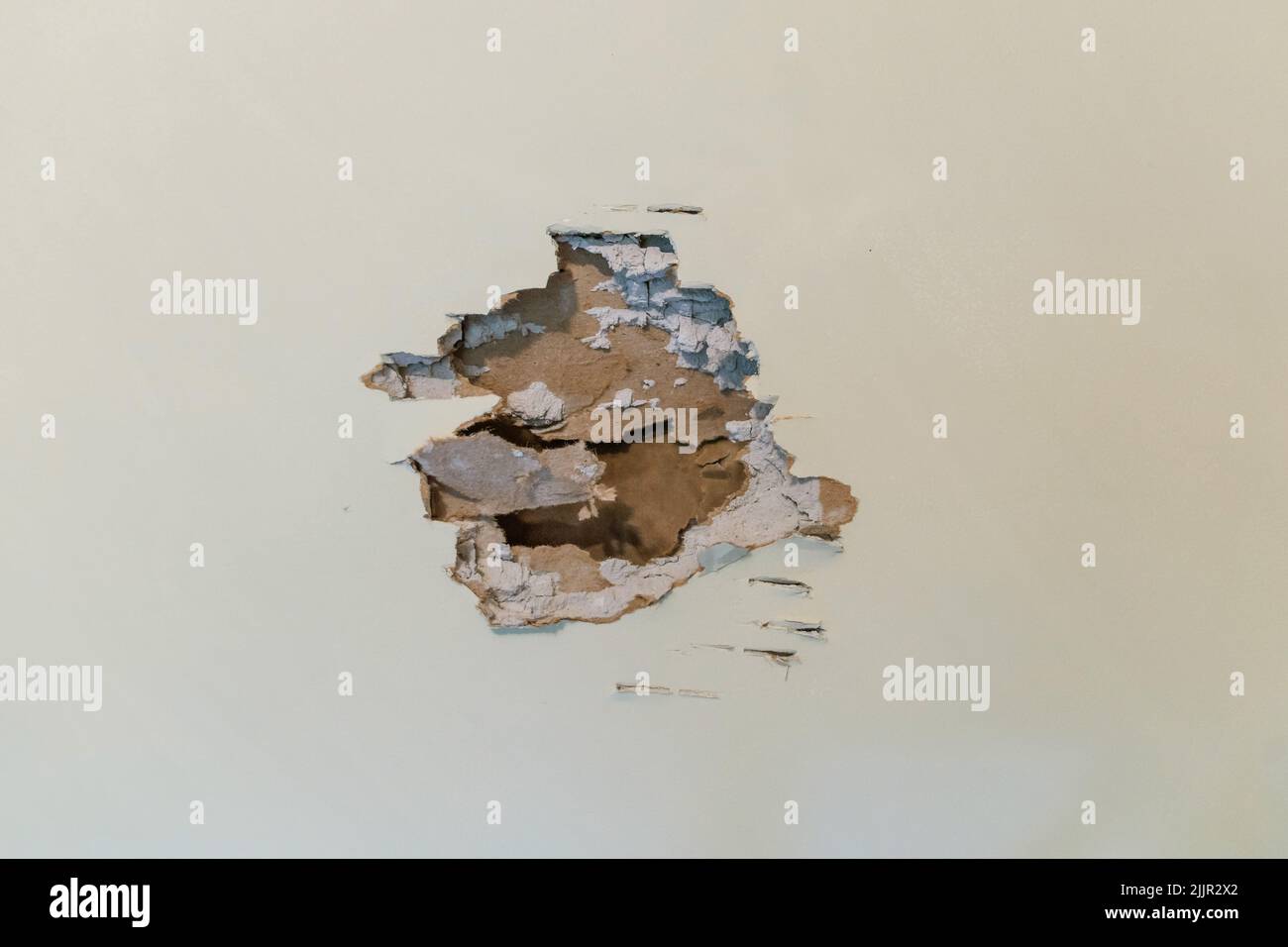 A hole in a sheetrock wall that needs repair and renovation Stock Photo